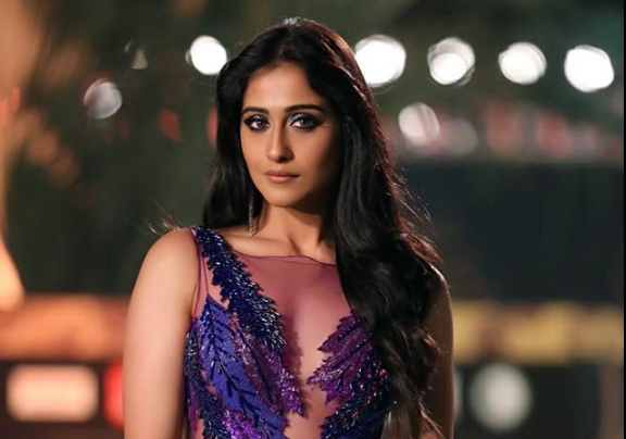 Regina Cassandra smiling during a public event