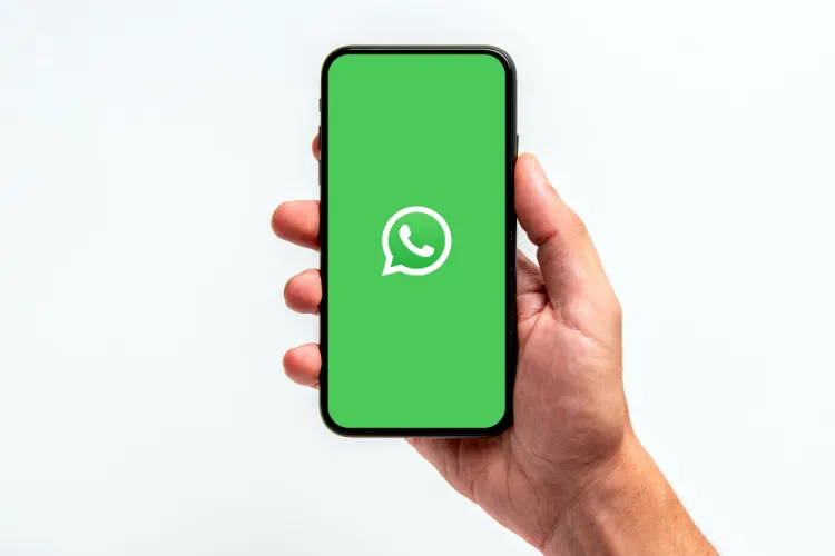 WhatsApp new green dot online status feature preview on mobile screen.